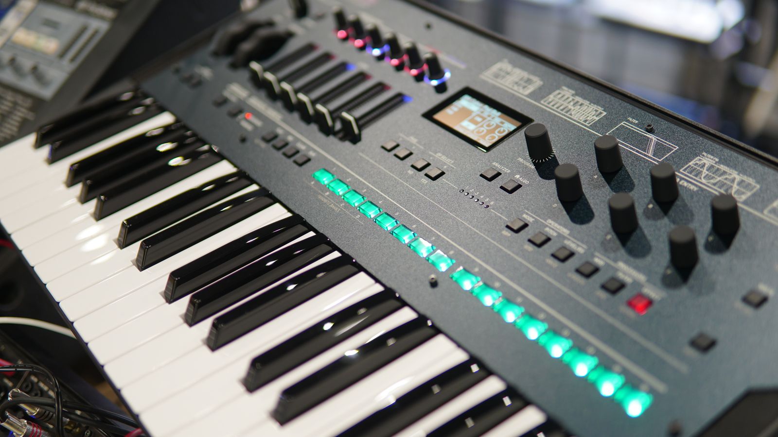 An electronic synthesizer with keys and sound controls