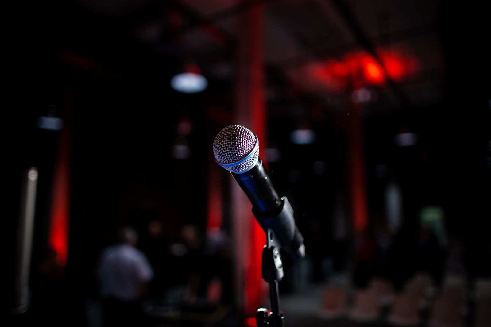 A microphone waiting on a stage before a performance
